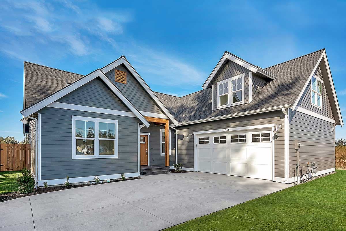House plan exterior with Craftsman style, single-story, featuring gabled roof, dormers, and attached garage with a front-facing orientation.