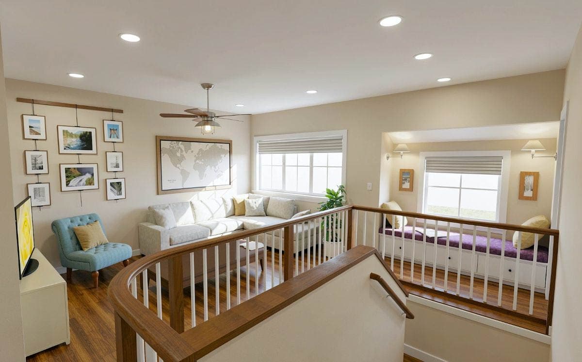 Interior view of a living space with a sectional sofa, built-in window seat, gallery wall, and map art.