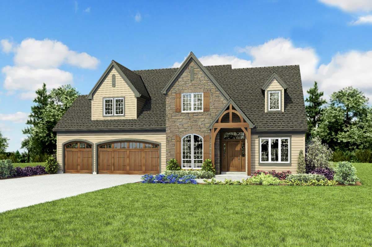 House plan exterior: Two-story home with stone facade, arched windows, dormers, and a triple garage.