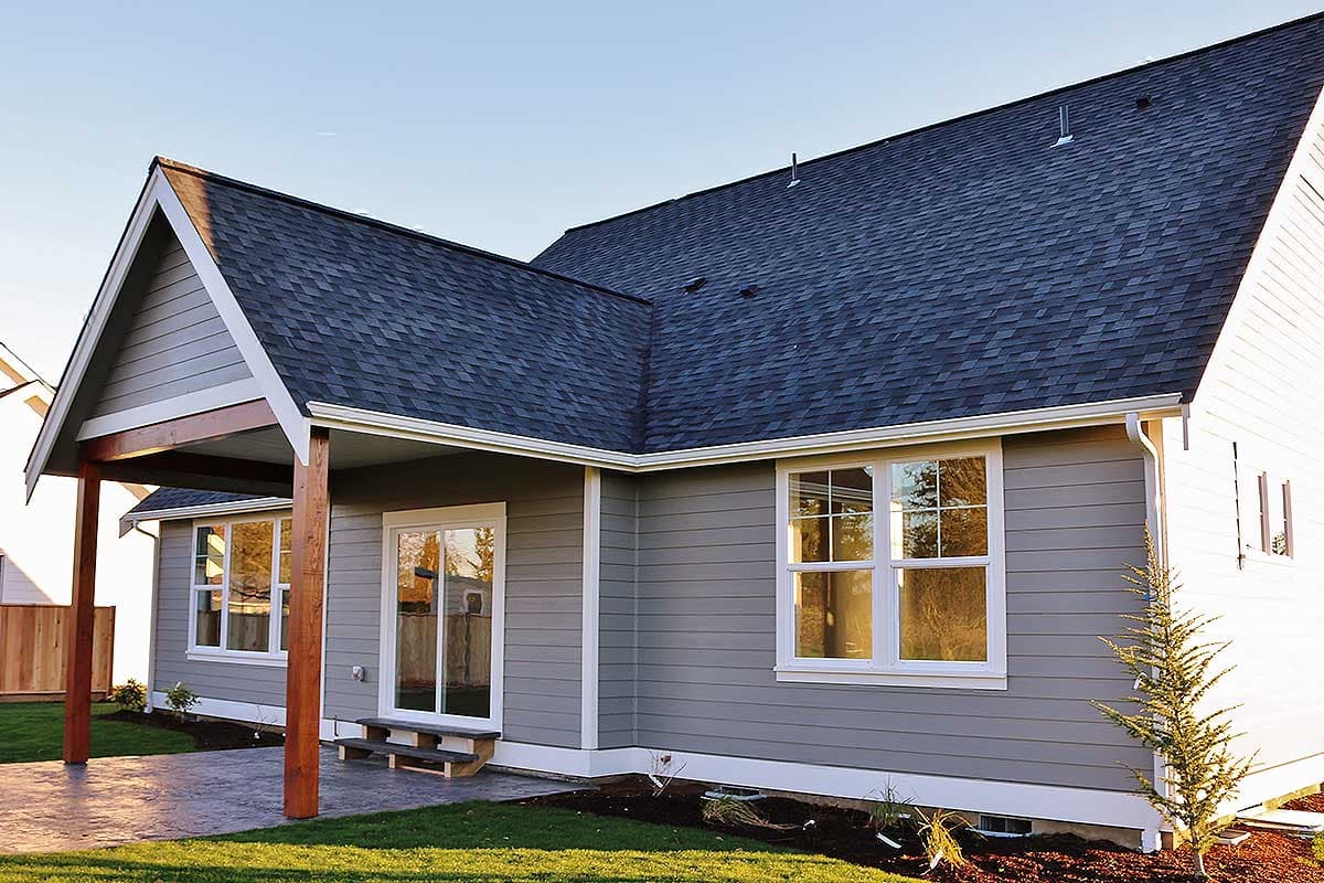 House plan exterior, one-story modern home with gable roof, covered patio, and horizontal siding.