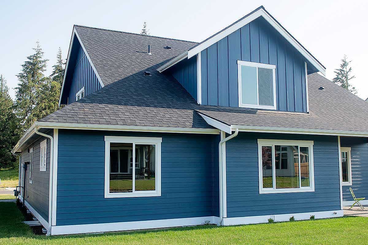 House plan exterior, two stories, blue siding, gabled roof with dormers, white trim, and asphalt shingles.