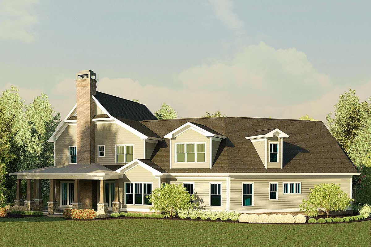House plan exterior: two-story home with prominent brick chimney, wraparound porch, multiple gables, and dormer windows.