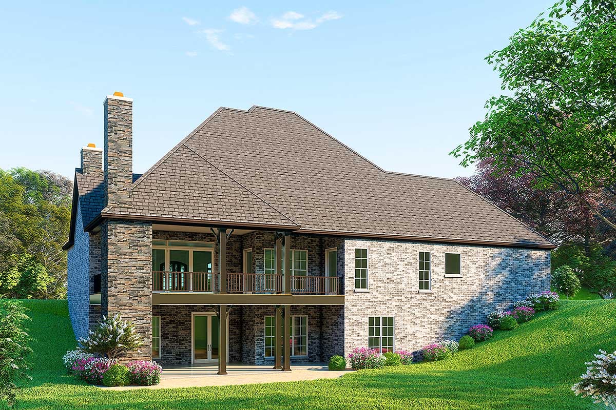 House plan exterior view with stone and brick facade, two stories, large gabled roof, and double-level balconies.