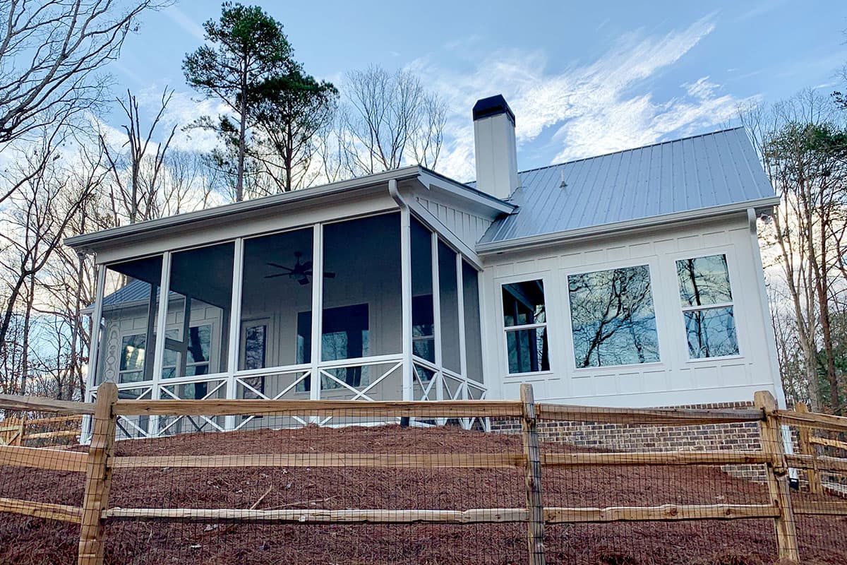 House plan exterior: Modern Farmhouse style, one-story, with screened porch, gables, and metal roof.