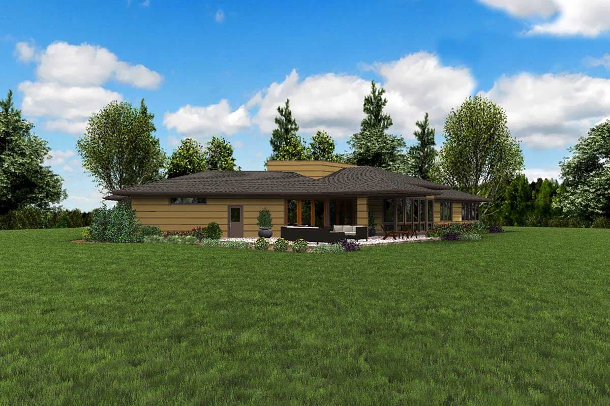 Single-story house plan exterior with a low-pitched roof, wide eaves, large windows, and covered patio with seating.