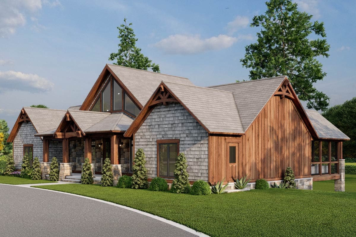 House plan exterior: Modern mountain style with large timber brackets, shingle siding, and a prominent gable with a triangular window.
