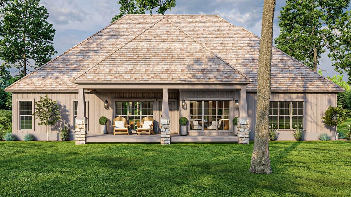 House plan exterior featuring a wide covered porch with stone-clad columns, wood siding, and a prominent hip roof with wood shakes.