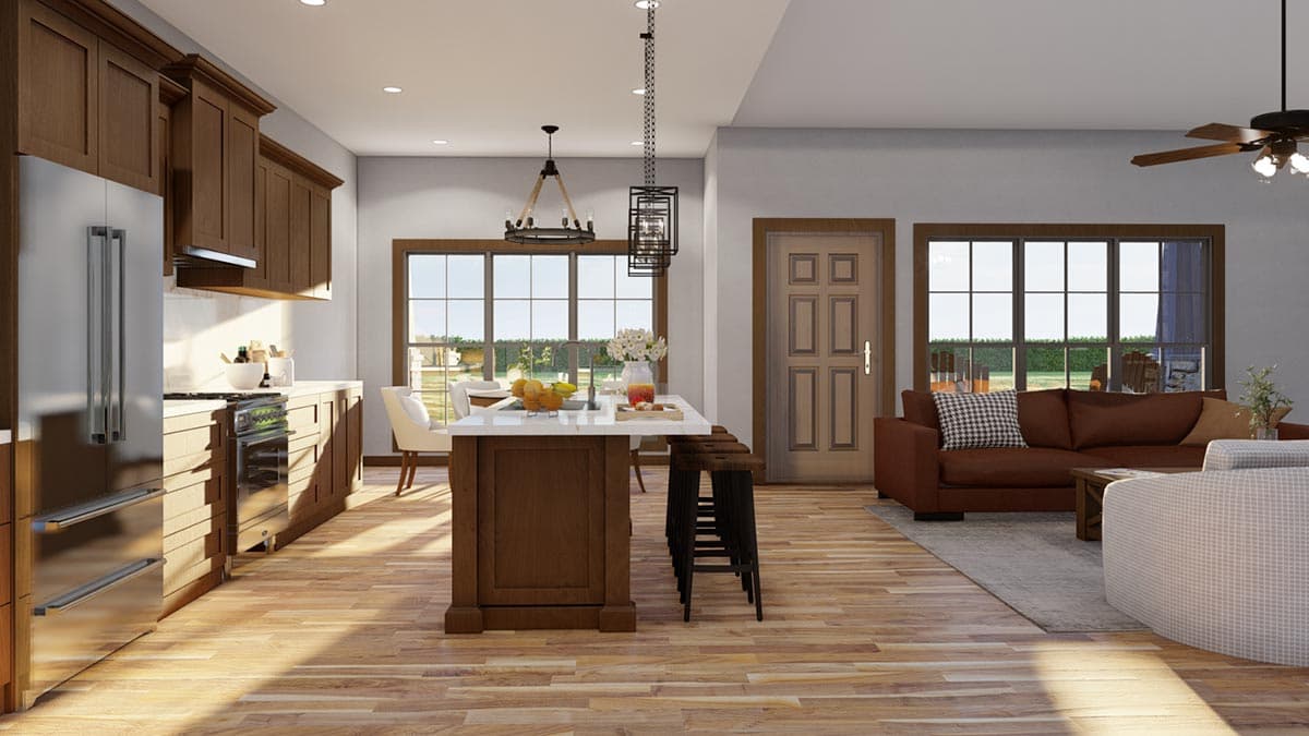 Open-concept kitchen and great room with wood cabinets, island, stainless steel appliances, and seating area.