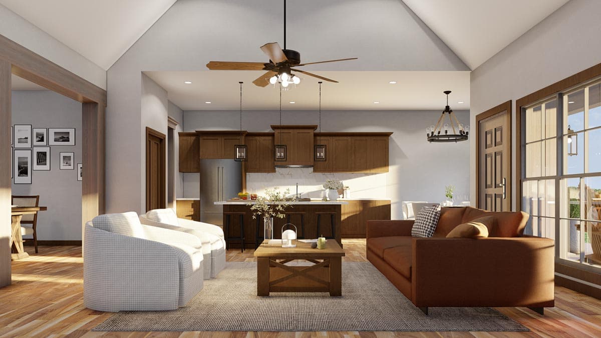 Open concept living area with vaulted ceiling, kitchen island, and comfortable seating.