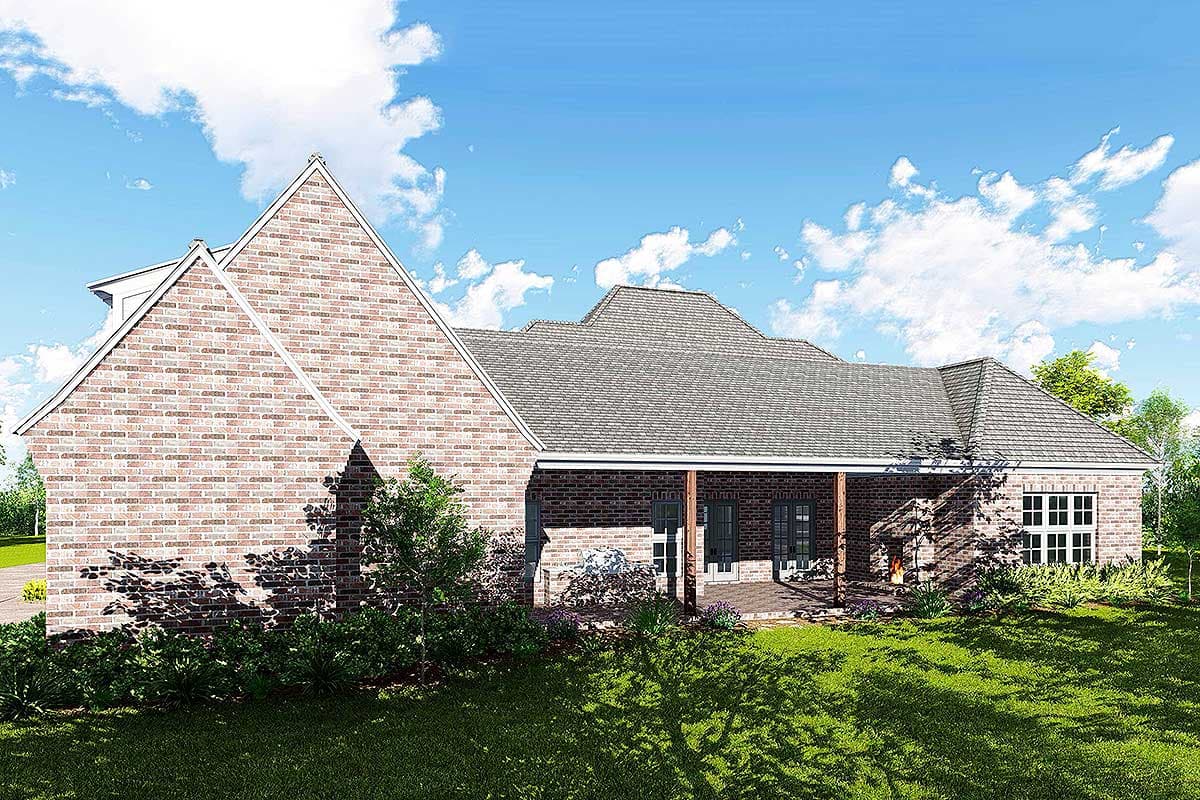 House plan exterior: Traditional brick home with a covered porch, dormer window, and multiple gables.