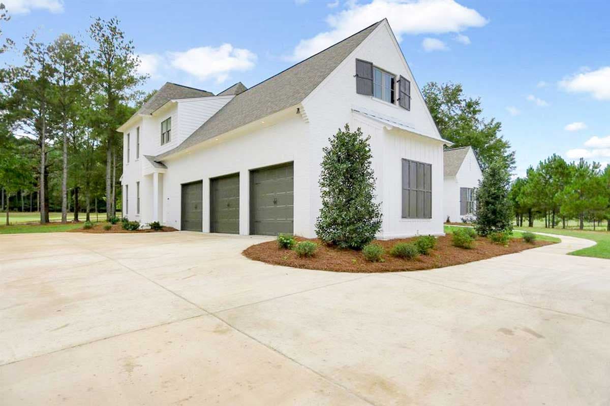 House plan exterior: Two-story Modern Farmhouse with three-car garage, gables, and dormers.