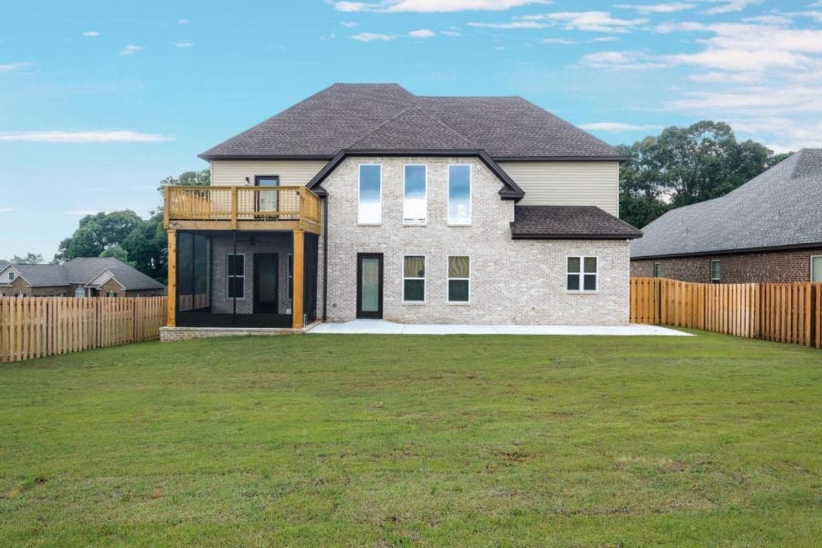 Two-story house plan exterior with white brick, large windows, wood deck, and screened porch.