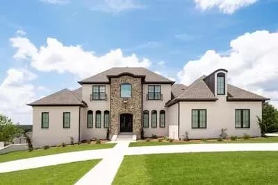 Three-Level Dream Home Plan with Main Level and Drive-Under Garages