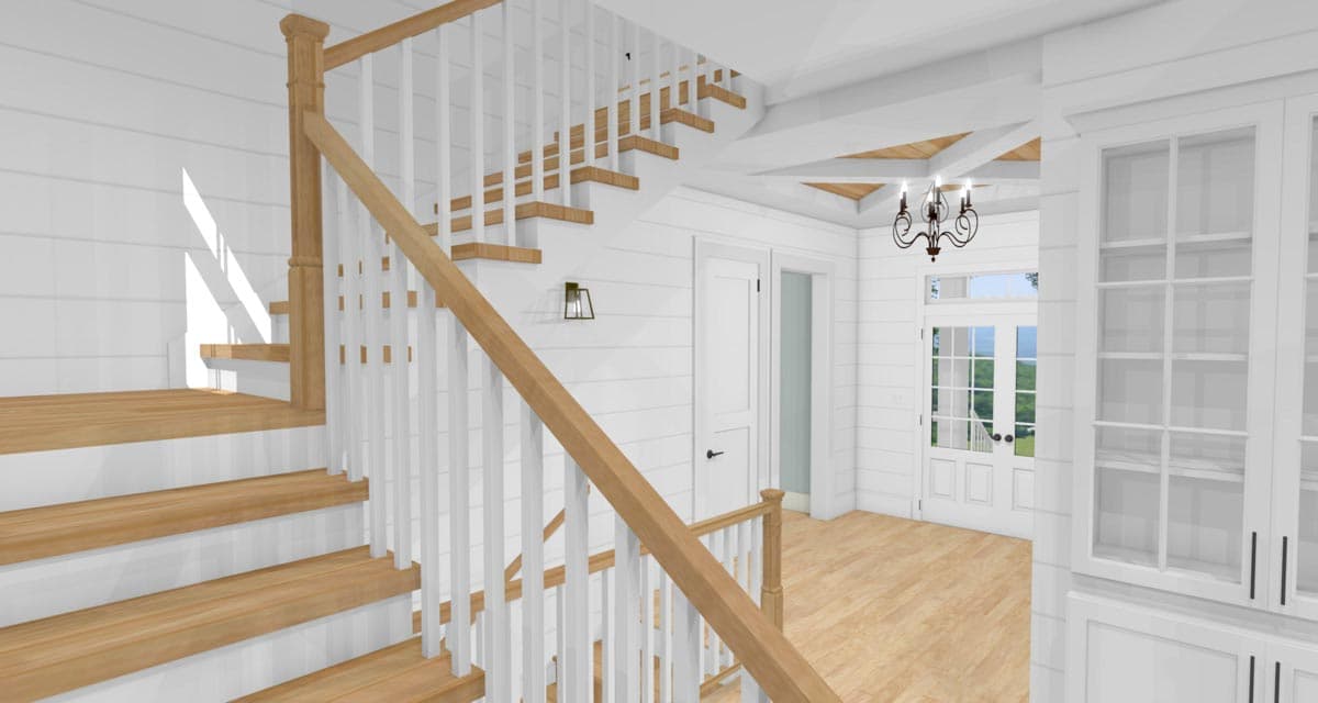 Interior view of a house entry with a wooden staircase, shiplap walls, glass-paned double doors, and built-in shelving.