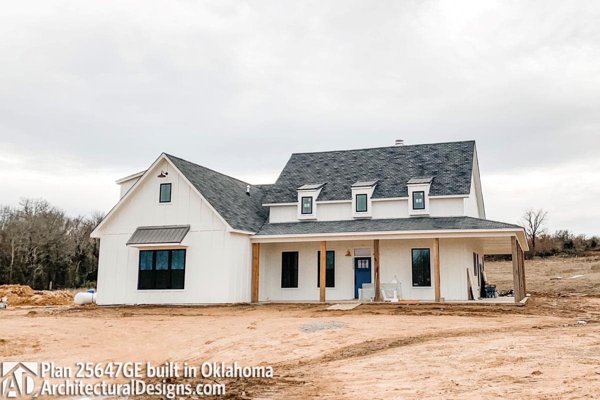 Modern Farmhouse house plan exterior with wide porch, gables, dormers, and board and batten siding.