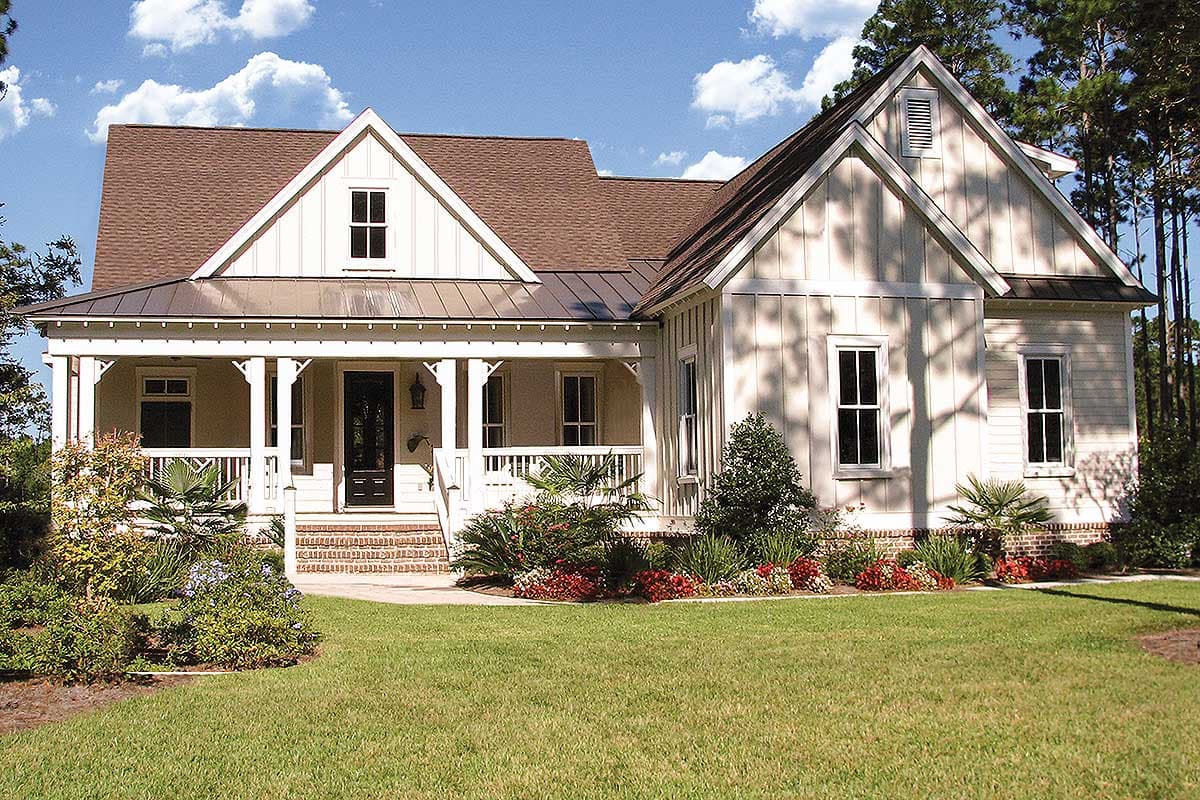 House plan exterior featuring a Craftsman style. The home has a gabled roof, a front porch with columns, and dormers.