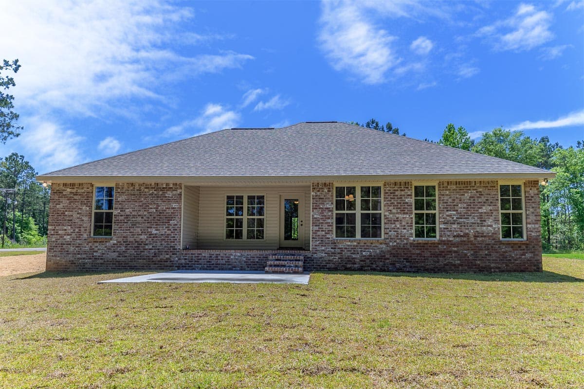 House plan exterior view of a one-story brick home with a covered porch, multiple windows, and a gray hip roof.