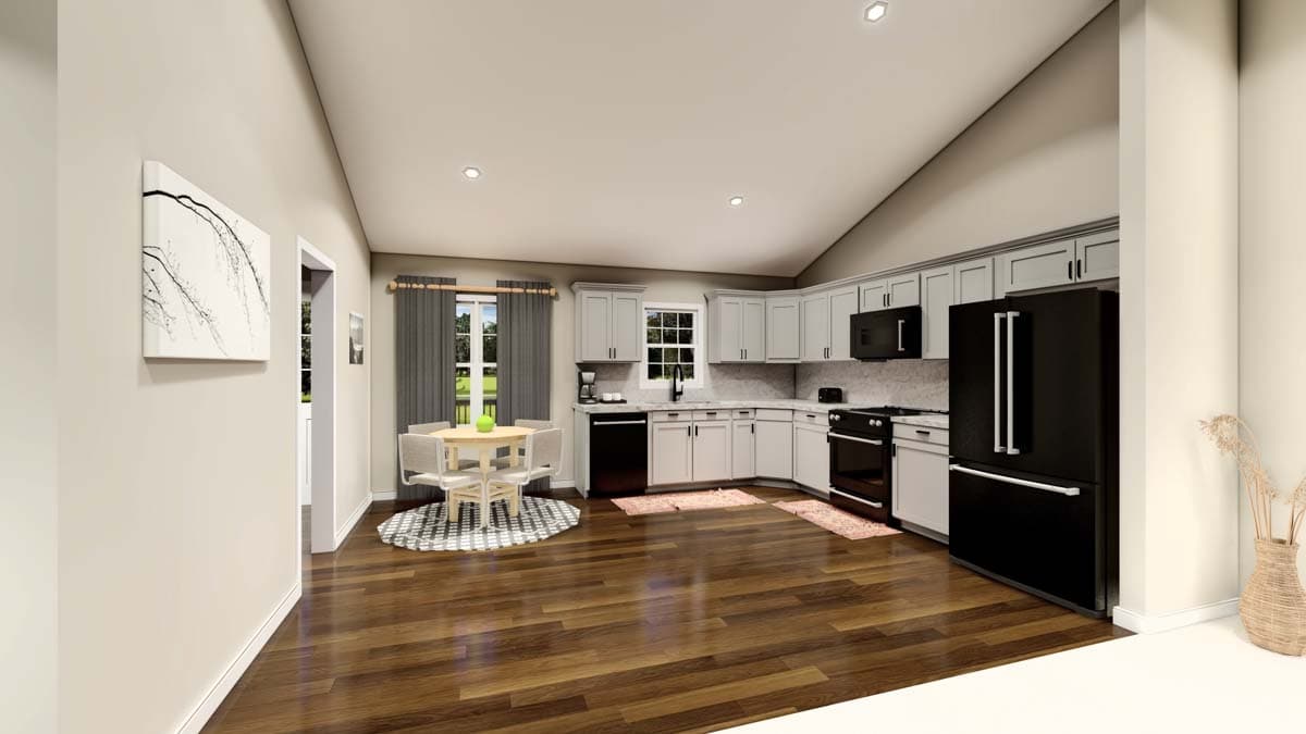 Kitchen with vaulted ceiling, light gray cabinets, black appliances, dining table and chairs, and wood floors.