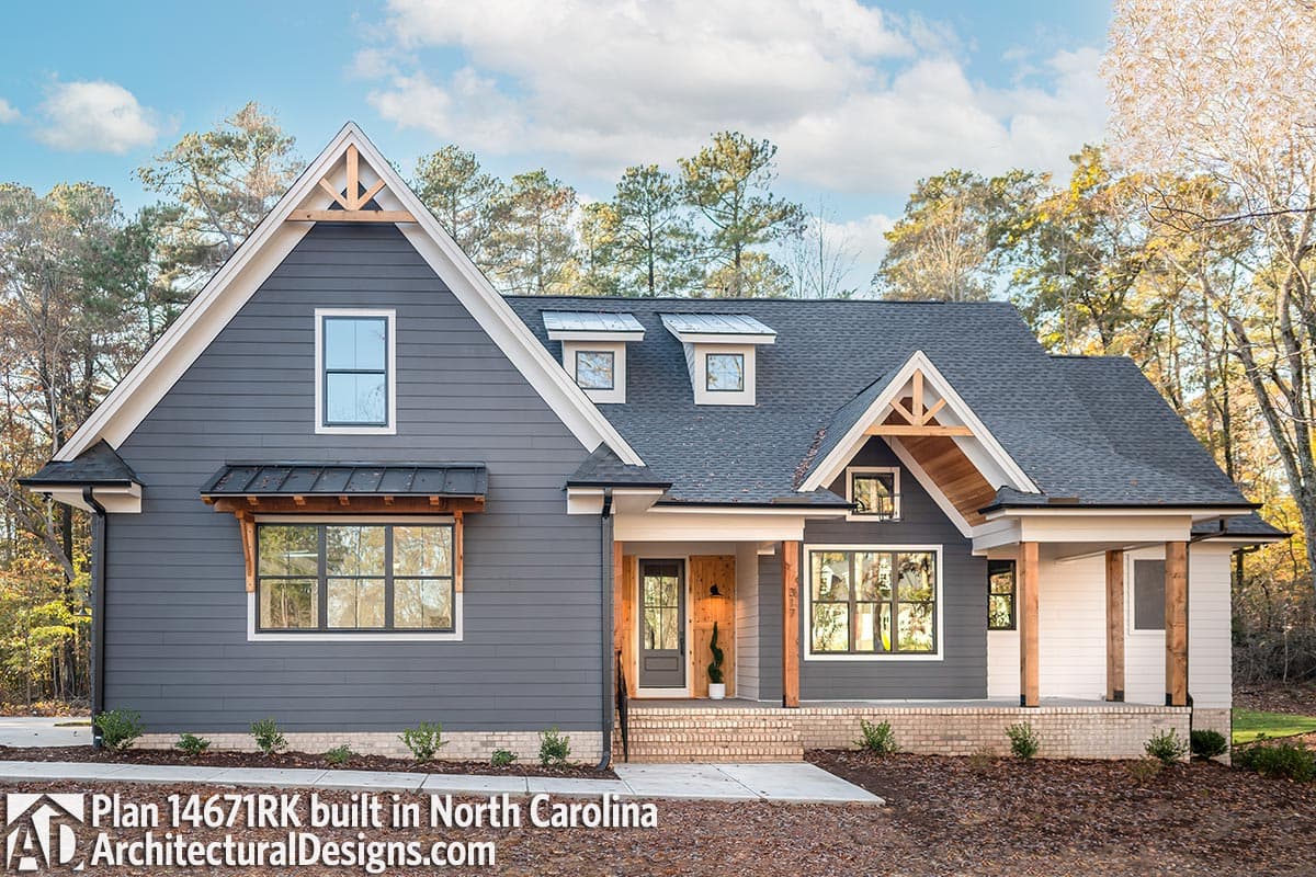 House plan exterior: Modern Farmhouse style, one story, with gabled dormers, exposed rafter tails, and covered front porch.