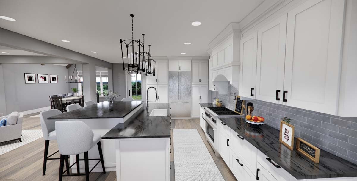 Kitchen with large island, stainless steel appliances, white cabinets, and a separate dining area.