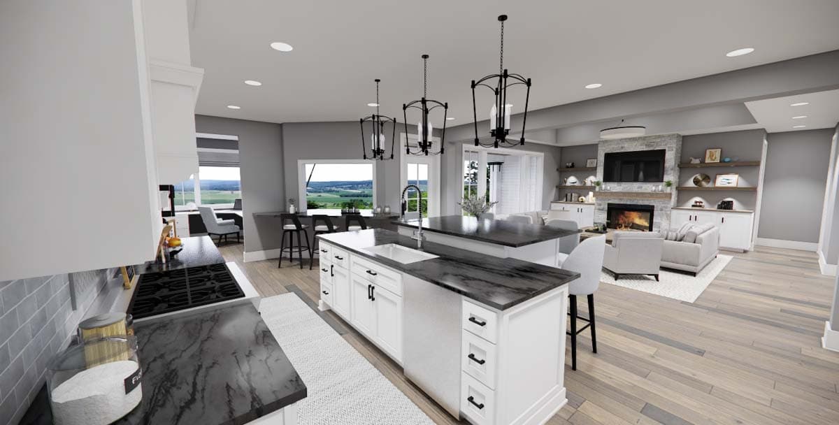 Open-concept kitchen and great room with large island, fireplace, and vaulted ceiling.