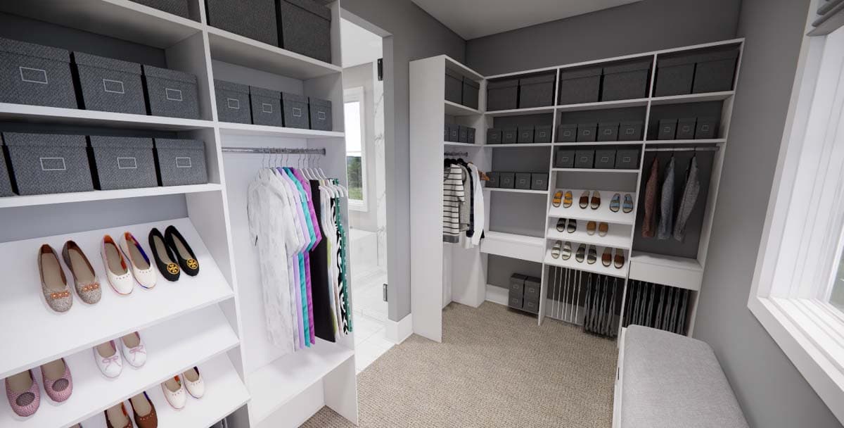 Walk-in closet with shelves, hanging rods, shoe racks, storage bins, and a bench.