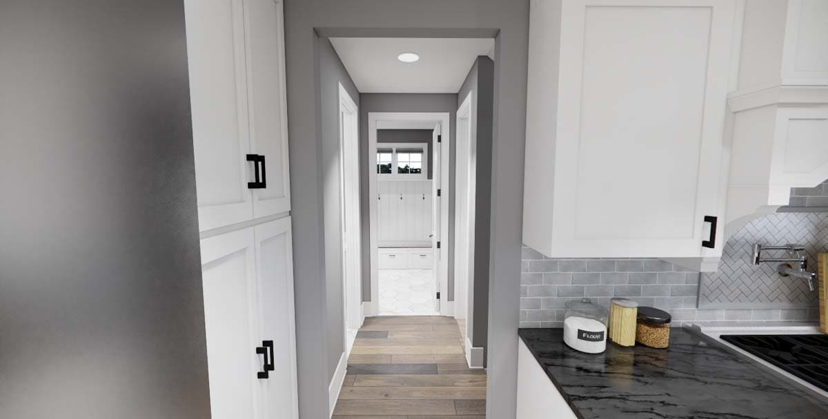 Interior view of a house plan showing a hallway leading to a mudroom with bench and storage.