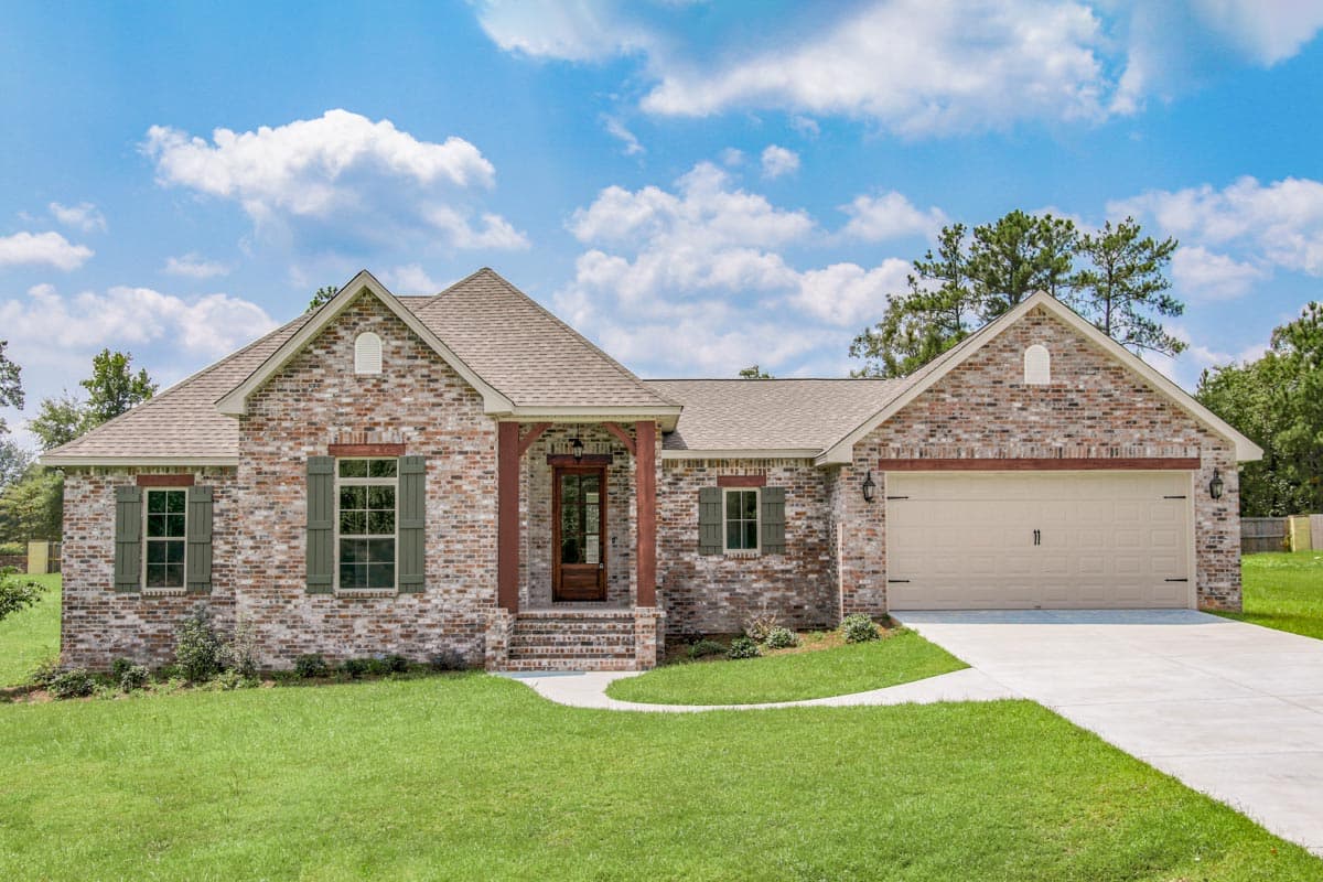 House plan exterior with brick facade, single story, front-facing gables, porch, and attached garage.