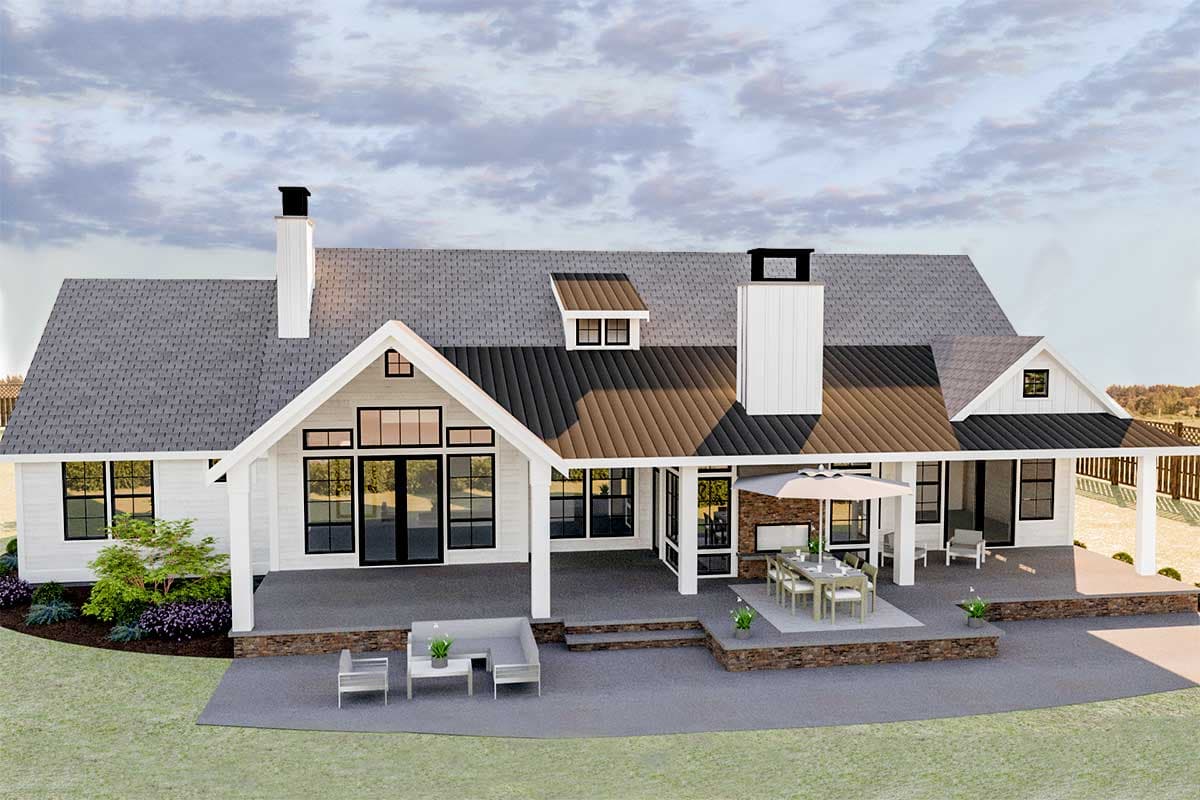 Modern Farmhouse style house plan exterior with a large covered porch, multiple gables, dormer windows, and two chimneys.