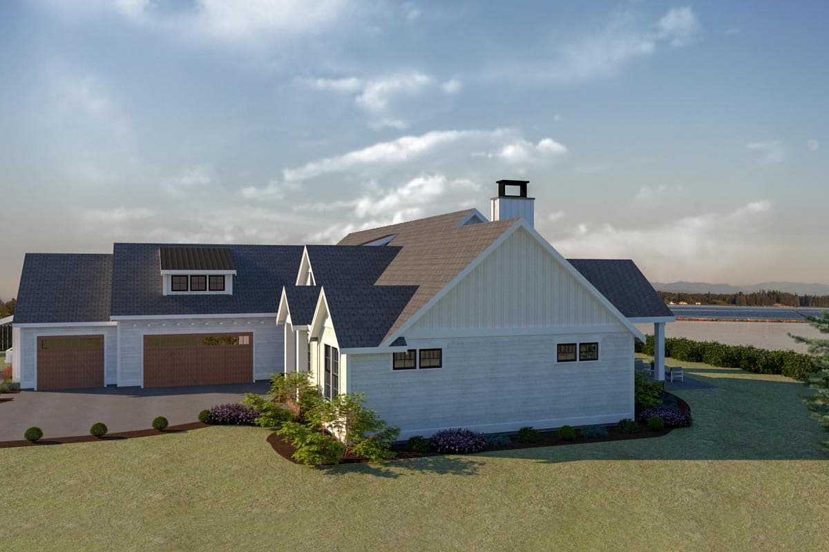 House plan exterior: Modern Farmhouse style, 1.5 stories, features a three-car garage, dormer, and covered porch.
