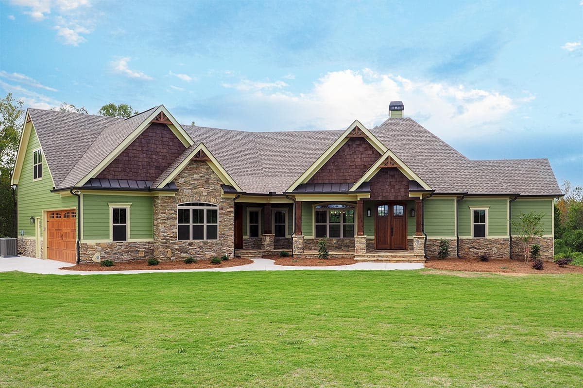 House plan exterior. Craftsman style with a single story, stone accents, gabled roof, and a front porch. Garage with wood door.