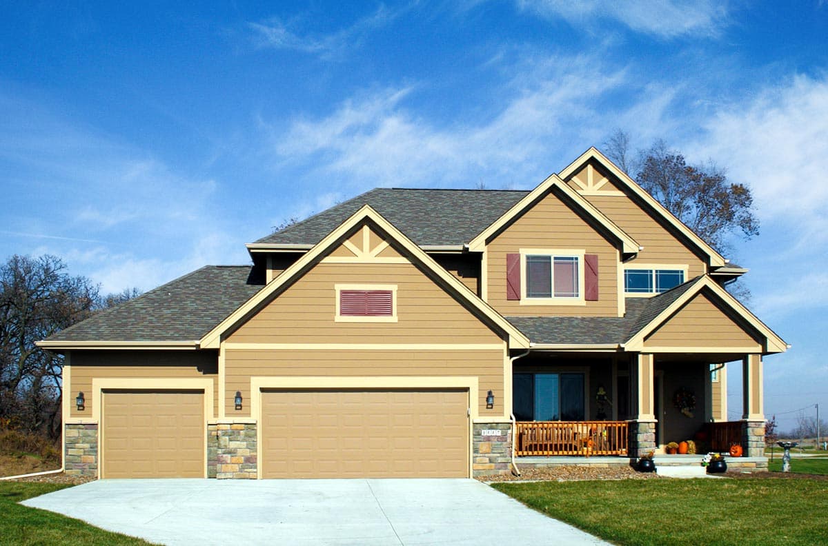 House plan exterior: two-story Modern Farmhouse with a prominent gable, covered porch, and a three-car garage.