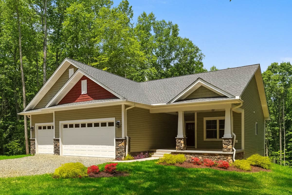 House plan exterior: one-story modern farmhouse with a covered porch, stone accents, and a three-car garage.