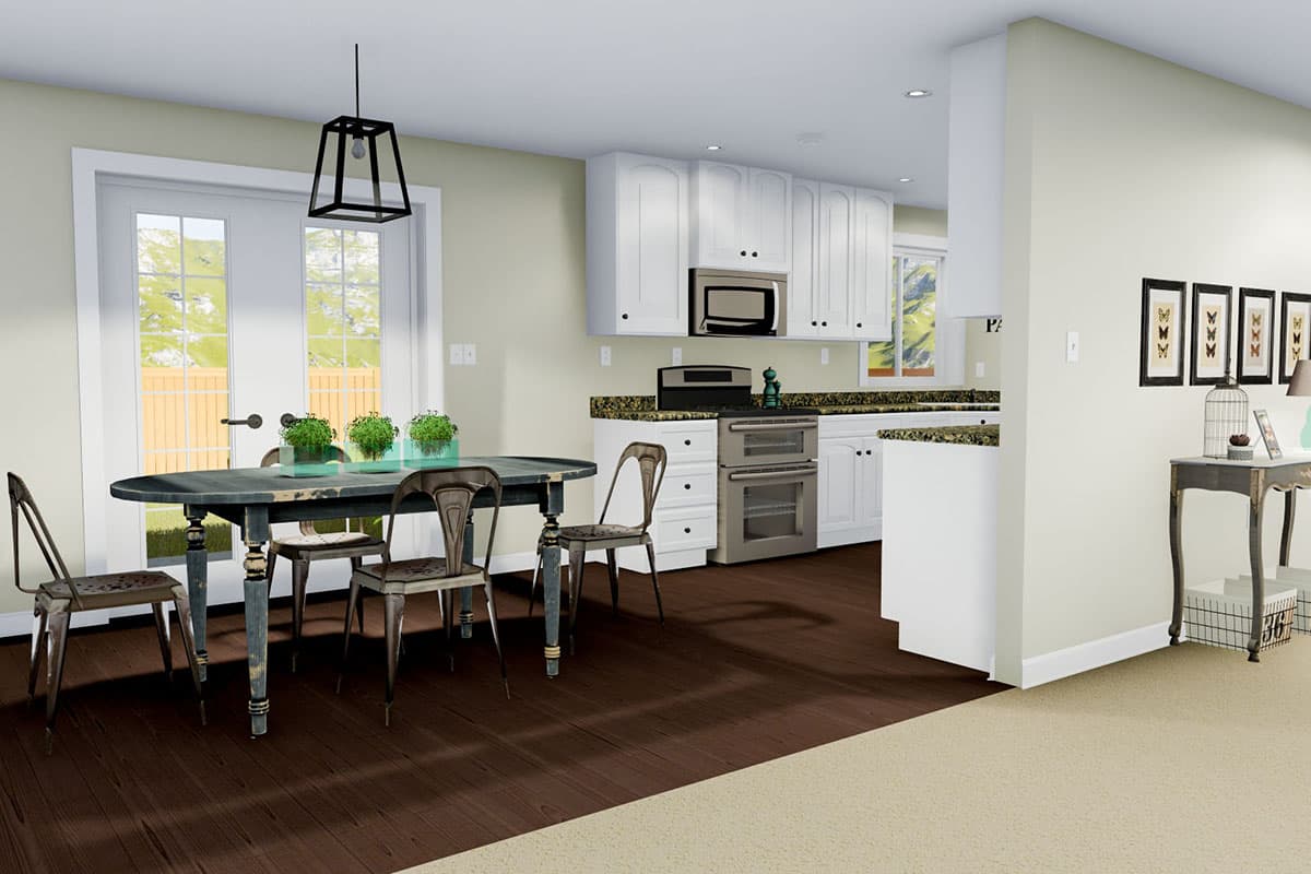 Dining area and kitchen with white cabinets, double oven range, island, and french doors.