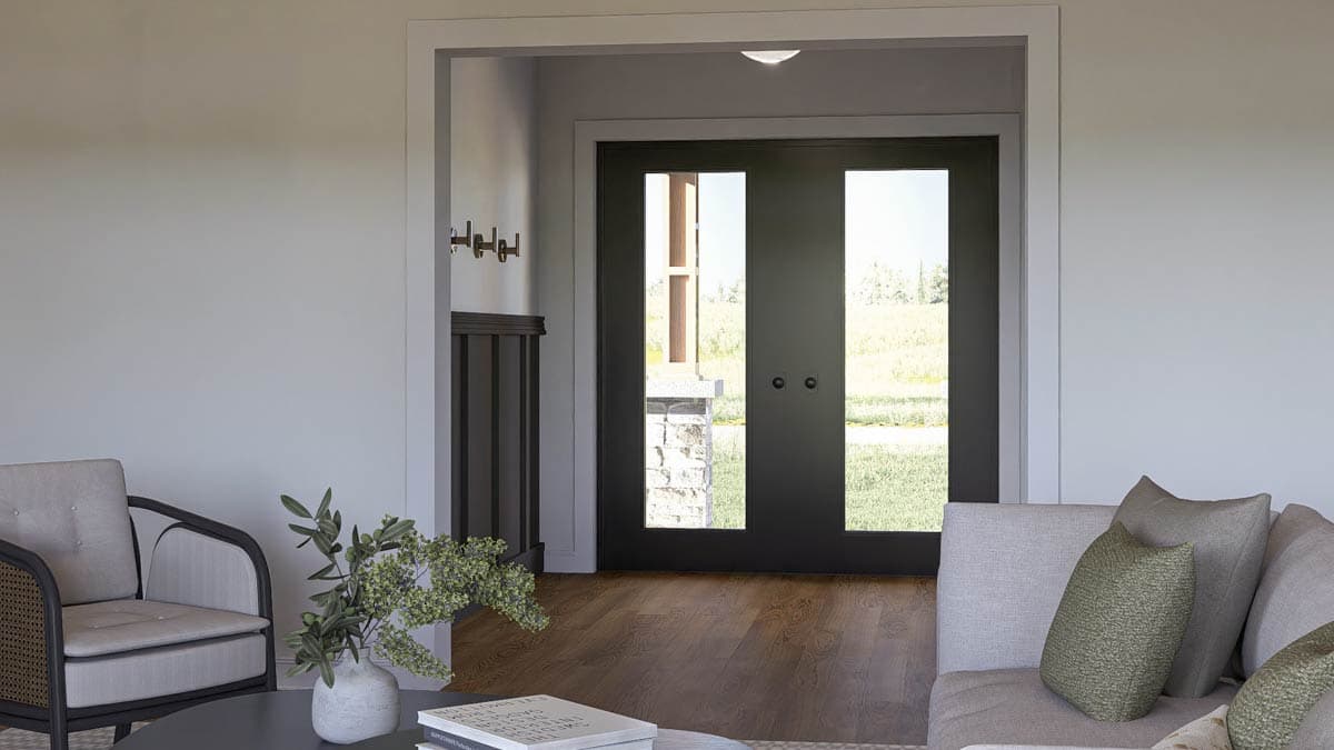 Interior view of an entryway with double front doors featuring glass panes, a coat rack, and a staircase railing.