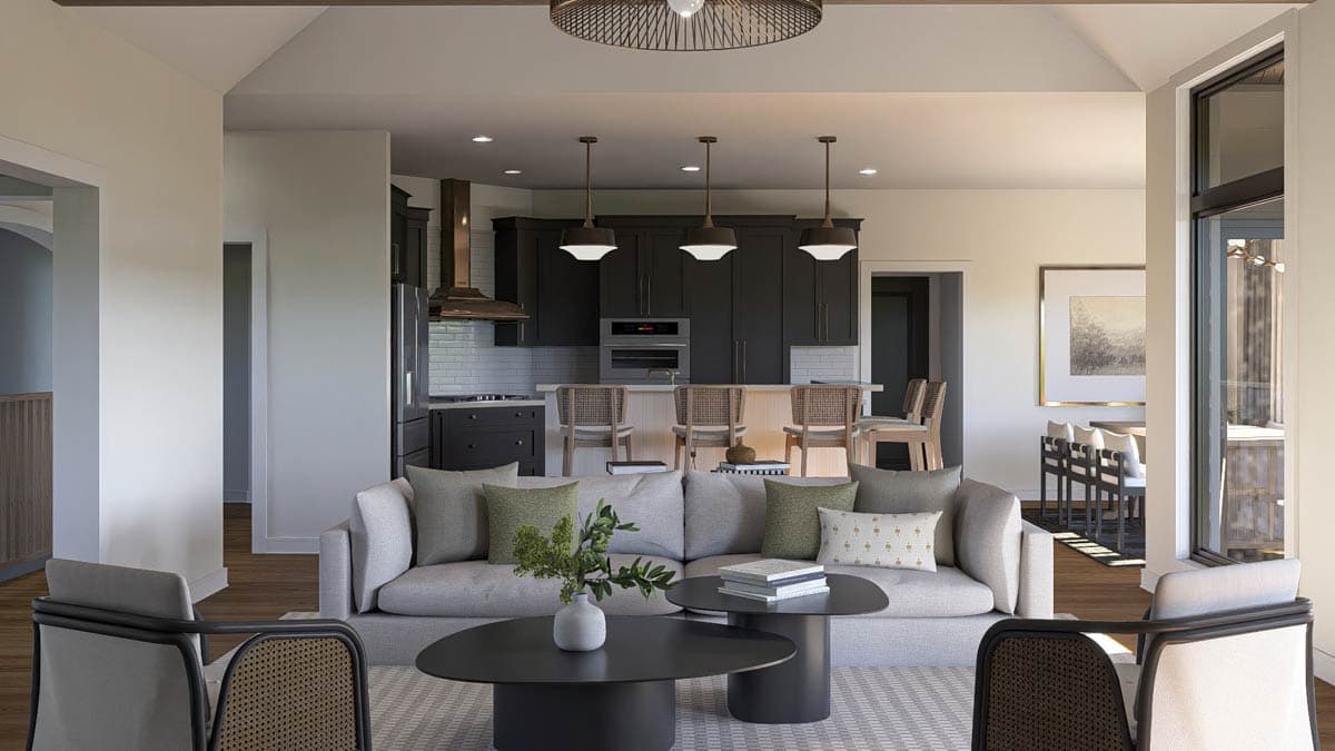 Interior rendering showing an open concept living area with a kitchen, dining space, and living room, featuring a large island and modern furniture.