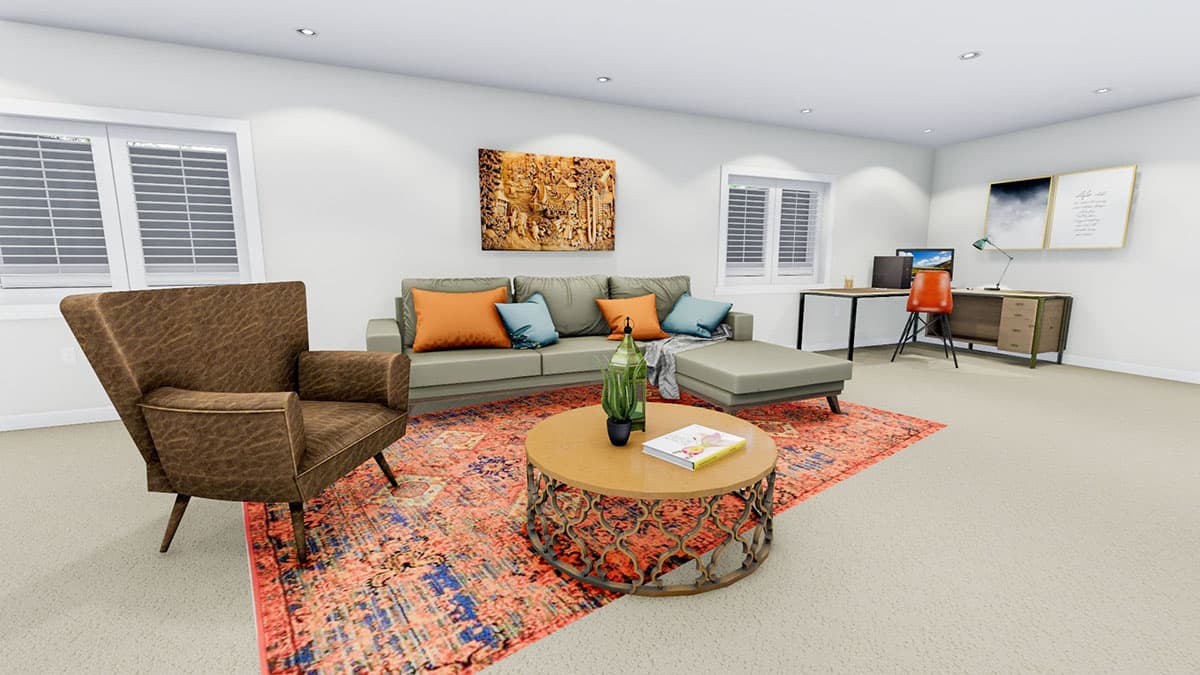 Living room with sectional sofa, accent chair, coffee table, and home office desk area. Large windows with blinds.