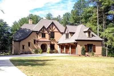 Exclusive 4-Bed Tudor House Plan with 3-Car Garage and Bonus Room