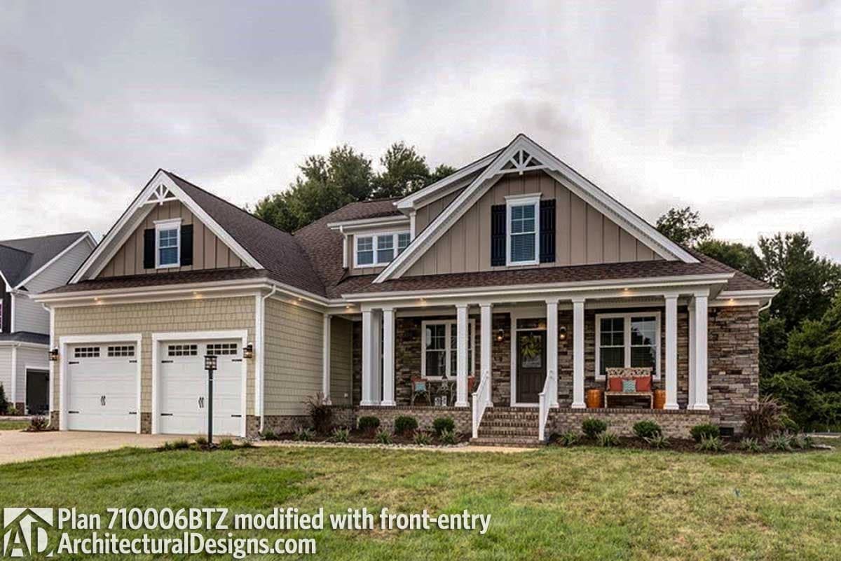 House plan exterior: One-story Modern Farmhouse with a covered front porch, stone accents, gables, dormers, and a three-car garage.