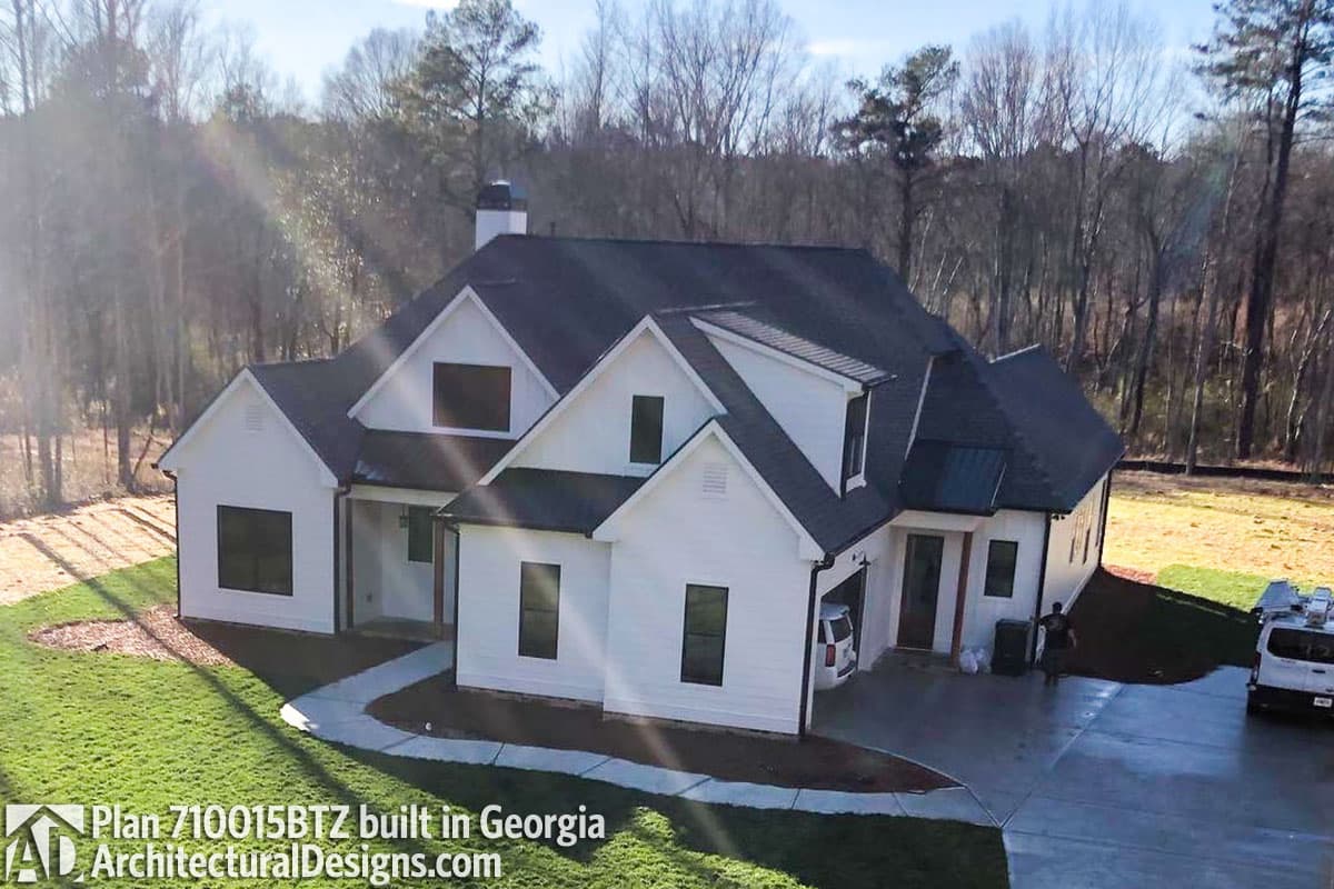 Modern Farmhouse house plan exterior with gables, dormers, and attached garage.