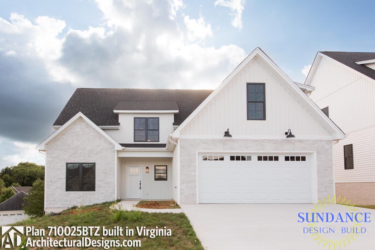 House plan exterior: Two-story Modern Farmhouse with stone accents, board and batten siding, dormer, and attached garage.