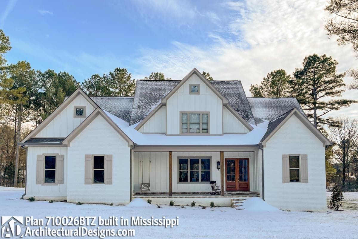 House plan exterior: Modern Farmhouse style, two stories, prominent gables, board and batten siding, and a covered front porch.