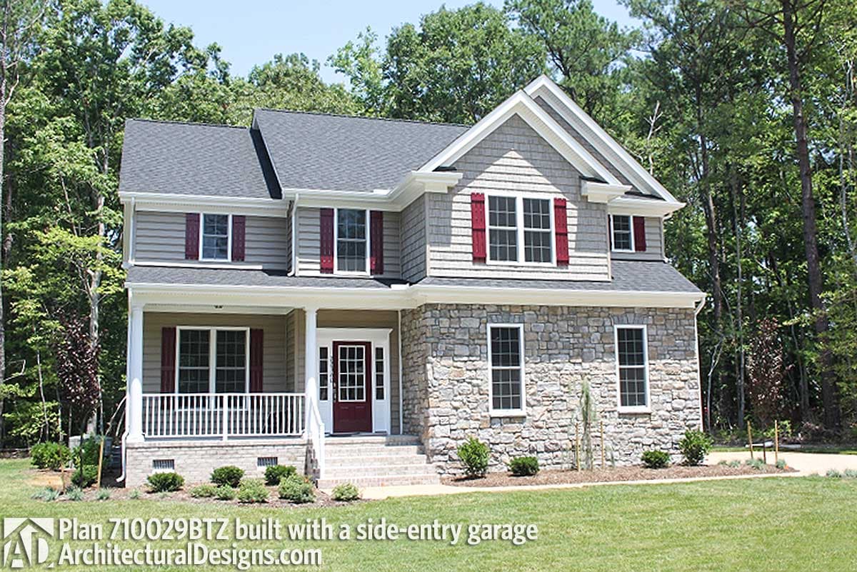 Two-story house plan exterior with stone facade, covered porch, gables, dormers, and side-entry garage.