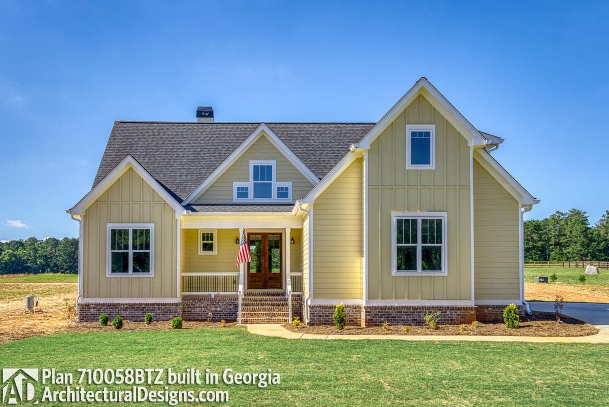 House plan exterior: Modern Farmhouse style, two stories, covered porch, prominent gables, and board-and-batten siding.