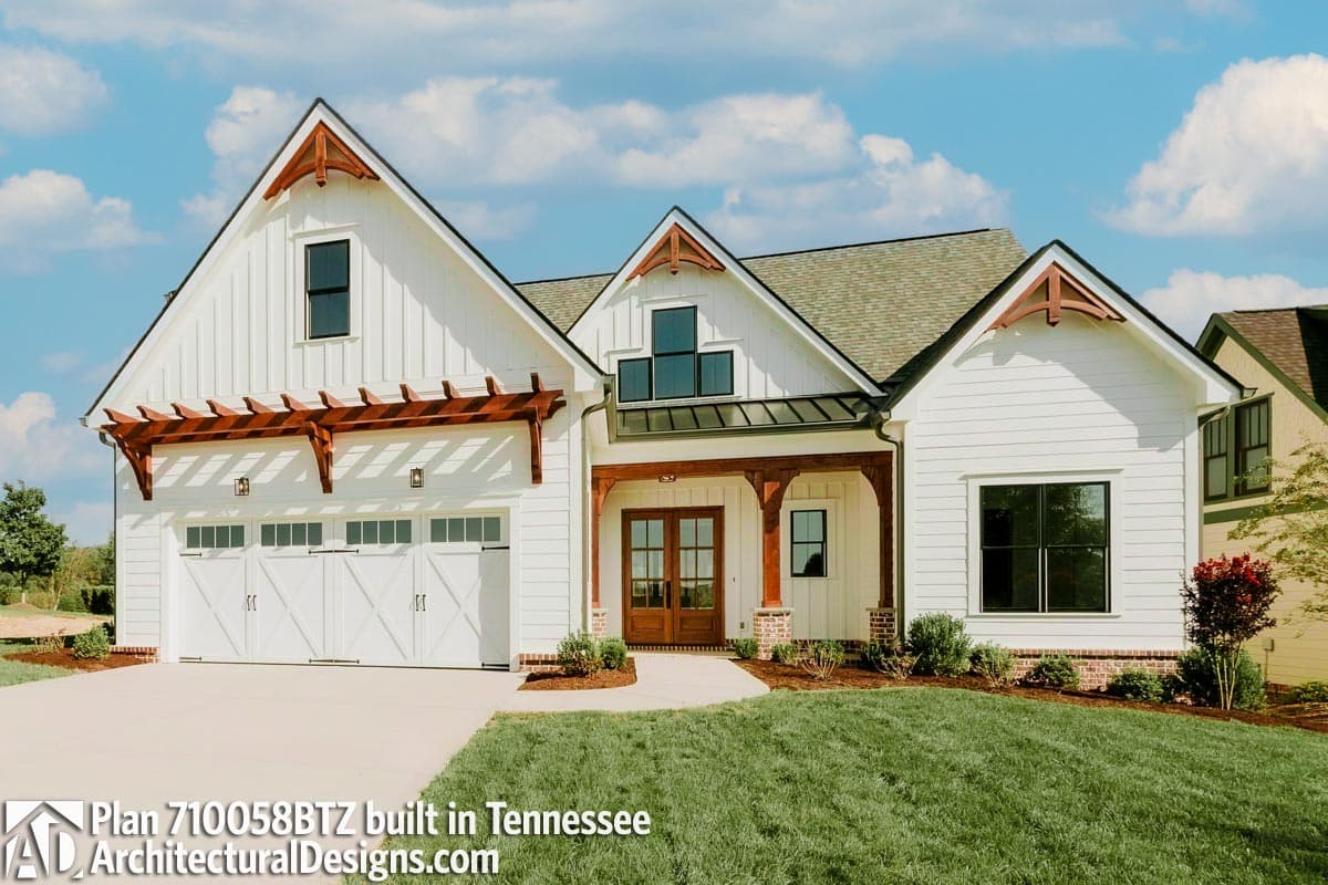 Modern Farmhouse style house plan exterior with a three-car garage, pergola, gables, and prominent entry.
