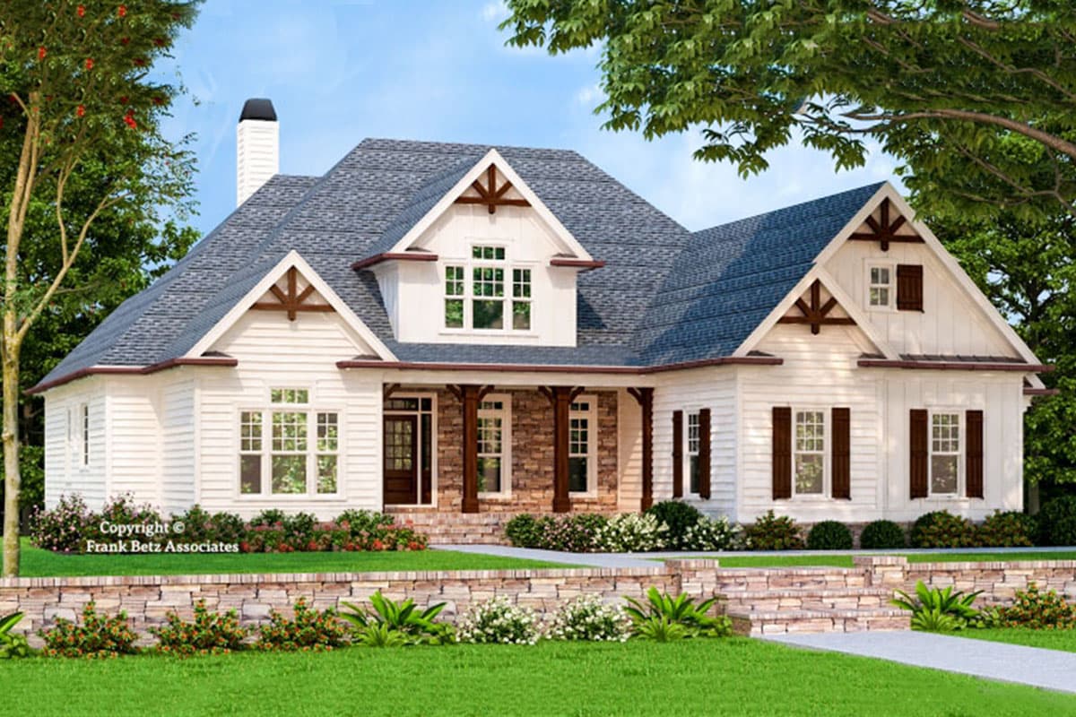 House plan exterior: Modern Farmhouse style, one story, featuring a covered front porch with stone accents, dormers, and gables.