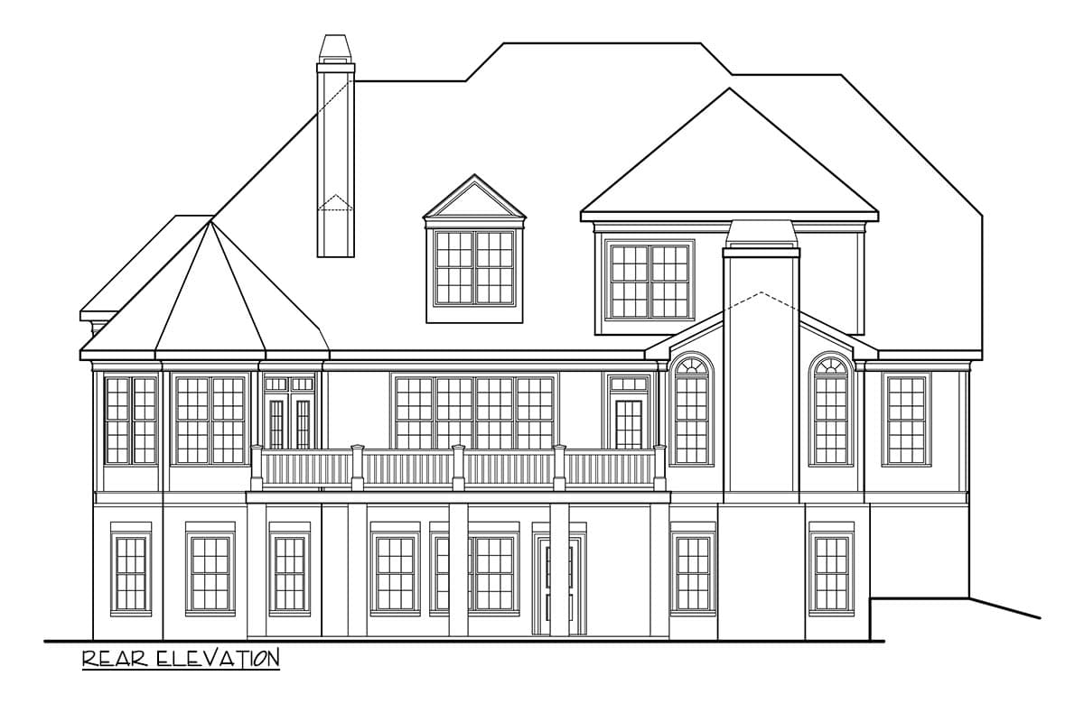 Rear elevation house plan showing a multi-story design with a prominent chimney, varied rooflines, a second-story balcony, and numerous windows.