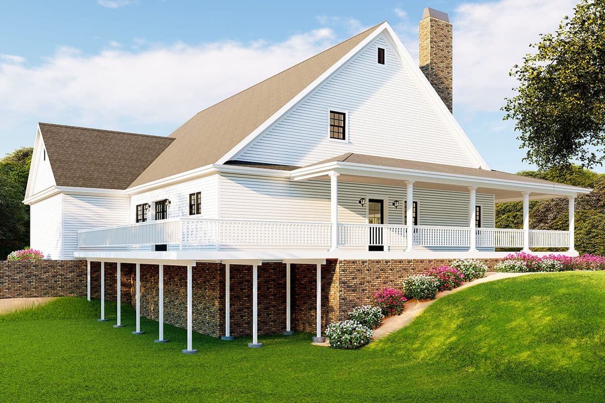 House plan exterior: white siding, full-wrap porch with columns, brick foundation, and prominent gable.