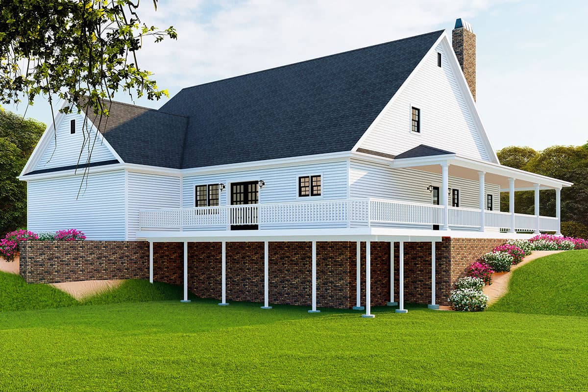 House plan exterior: two-story house with a wraparound porch, brick foundation, gables, and a prominent stone chimney.
