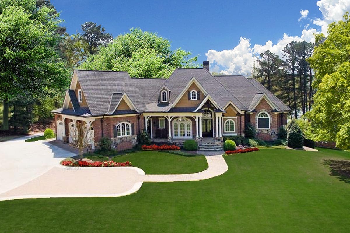 House plan exterior: One-story brick home with a wraparound driveway, porte-cochère, gabled dormers, and arched windows.